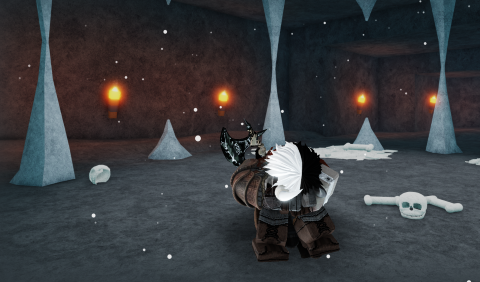 The man with horns again in another cave, sitting with his face in between his legs, crying.